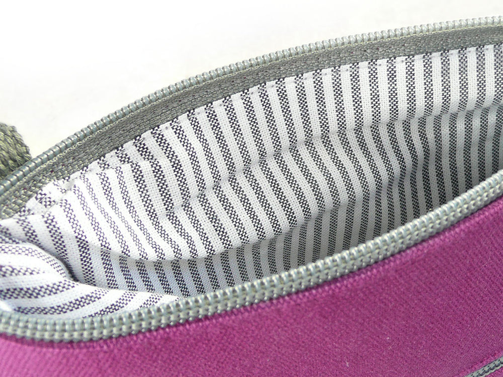 Interior grey and white lining of pink canvas bag