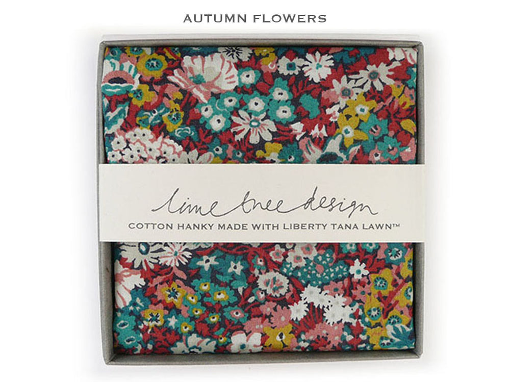 A folded cotton hanky with an 'Autumn Flowers' floral print, presented in its gray gift box with a white paper band reading 'lime tree design'.