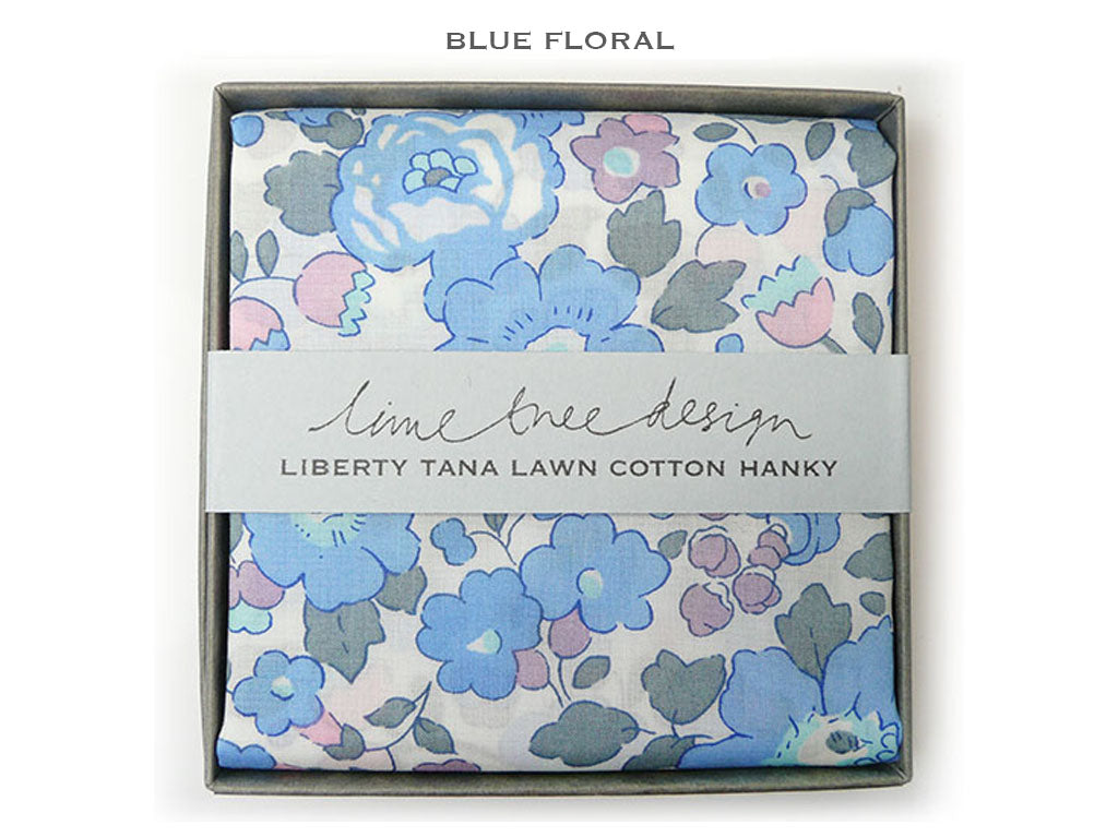 A boxed cotton hanky with a blue floral print, shown in a square presentation box with a white paper band reading &
