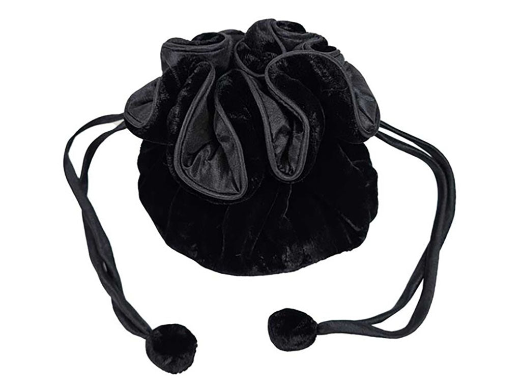 A black velvet drawstring pouch bag with a gathered top and long pom-pom ties, shown on a plain white background.