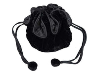 A black velvet drawstring pouch bag with a gathered top and long pom-pom ties, shown on a plain white background.