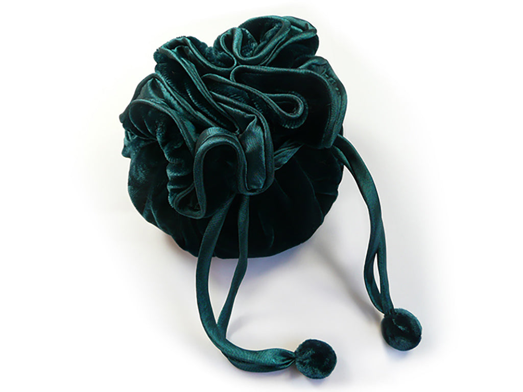Velvet jewellery pouch with ties on a white background