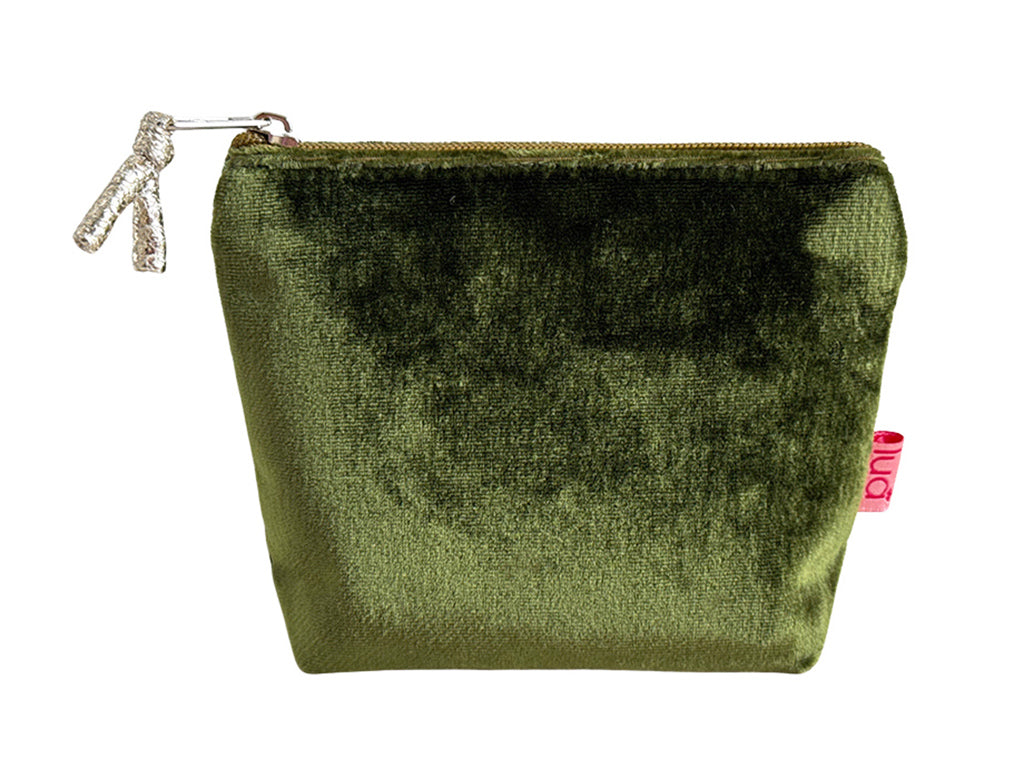 An olive green velvet zipped pouch with a silver zipper pull and a small pink 'Lua' brand tag on the side, shown against a plain white background.