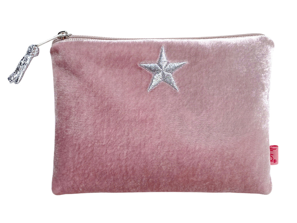 A pink velvet zippered pouch featuring a silver embroidered star on the front and a silver zipper pull, shown against a plain white background.
