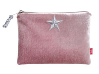A pink velvet zippered pouch featuring a silver embroidered star on the front and a silver zipper pull, shown against a plain white background.