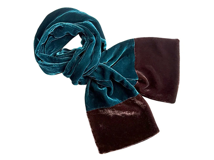 A velvet scarf with a colour-blocked design, featuring a teal green section and a dark brown section, shown on a plain white background.