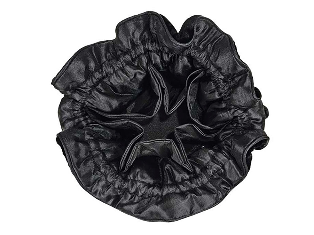 View of the inside of a jewellery pouch with a gathered, ruffled satin fabric, shown against a plain white background.