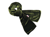 An olive green velvet scarf, styled in a loose knot, displayed against a solid white background.